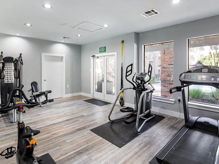 Our fitness center features TRX bands, strength training machines, cardio machines and more for our residents.