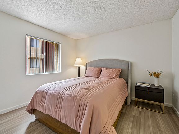A restful bedroom with natural light.
