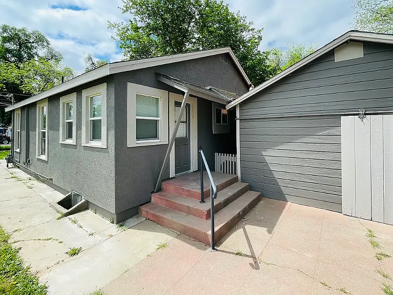 Rear of house and detached garage with laundry area