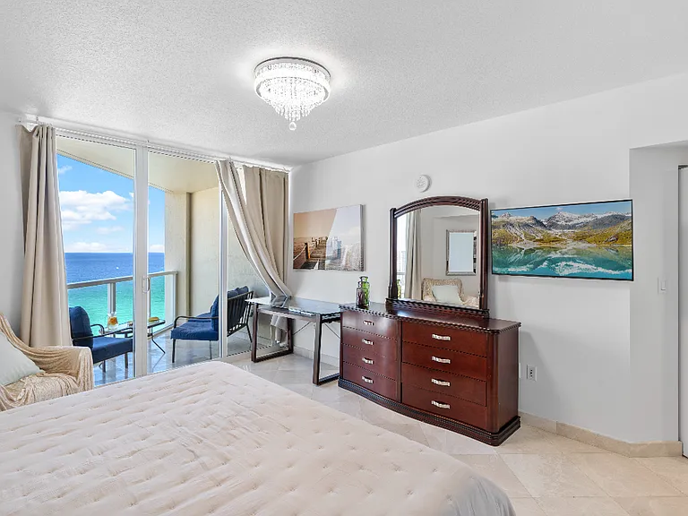 Master Bedroom Suite _ Features two spacious walk-in closets, a private balcony, and a luxurious jacuzzi jet tub.