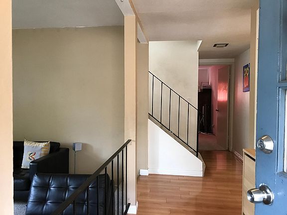 Entry way with step-down living room on left