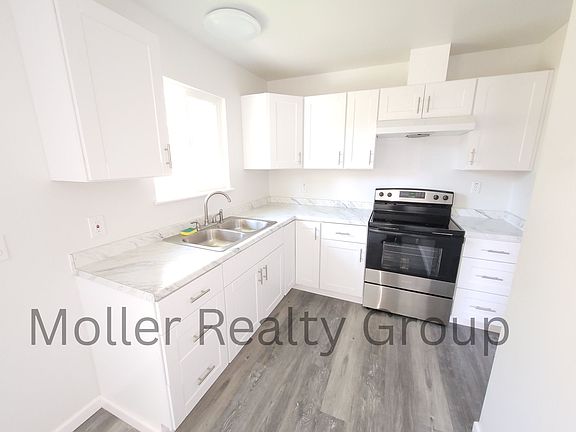 Kitchen, Electric Range/Oven. Stainless Steel Sink. Goose Neck Faucet. New Counter Tops. New Cabinets.
