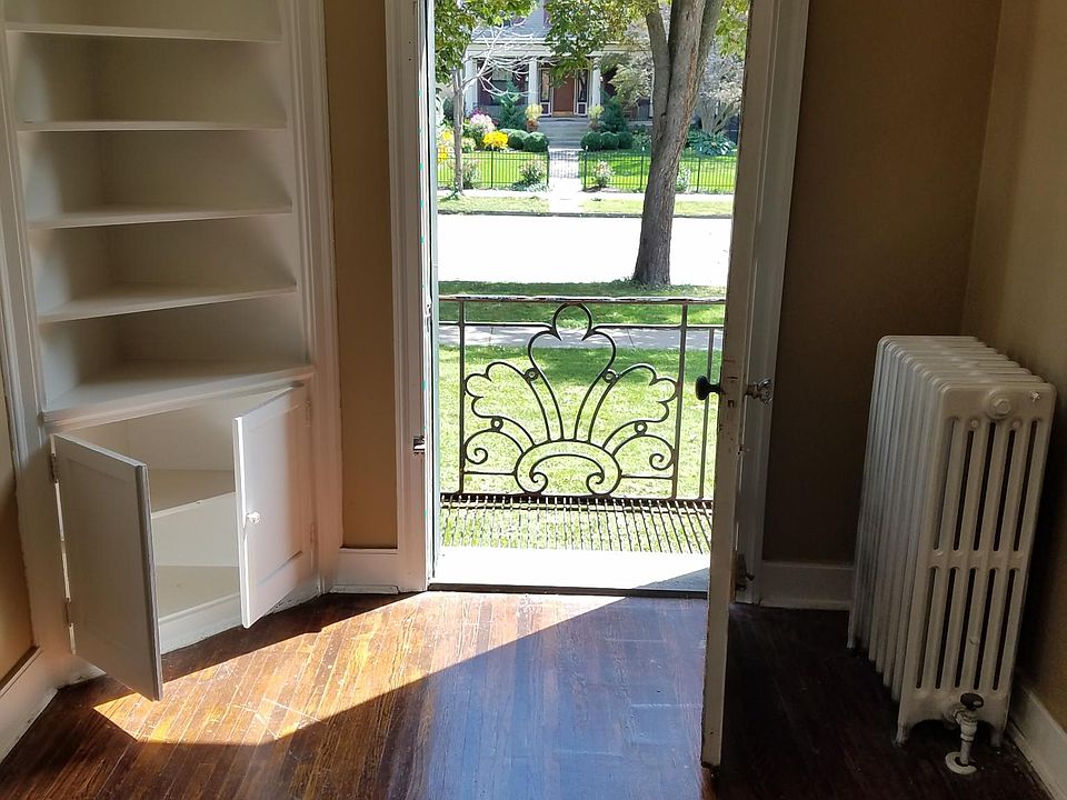 Dining area overlooking your private 1st floor balcony. Beautiful view across Delaware Ave