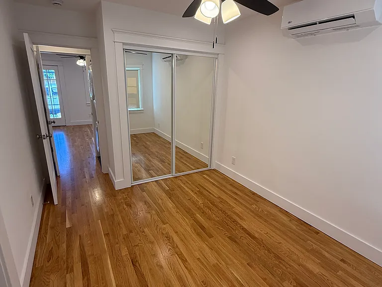 MASTER BEDROOM - VIEW TO LAUNDRY ROOM AND LIVING AREA