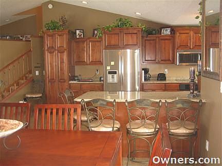 Stainless steel appliances, alder custom cabinets, granite tops