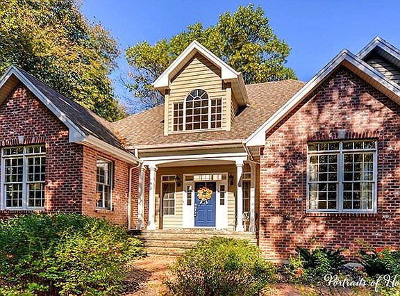 Custom brick & cedar home!  Cedar re-painted in 2016