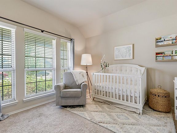 The photo was taken during prior occupancy. All furniture, decor, and personal items shown are for staging/illustrative purposes only and are not included with the home.