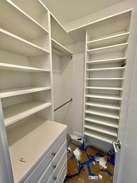 Custom closet organizers already installed in both walk in closets