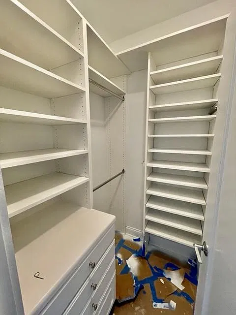 Custom closet organizers already installed in both walk in closets
