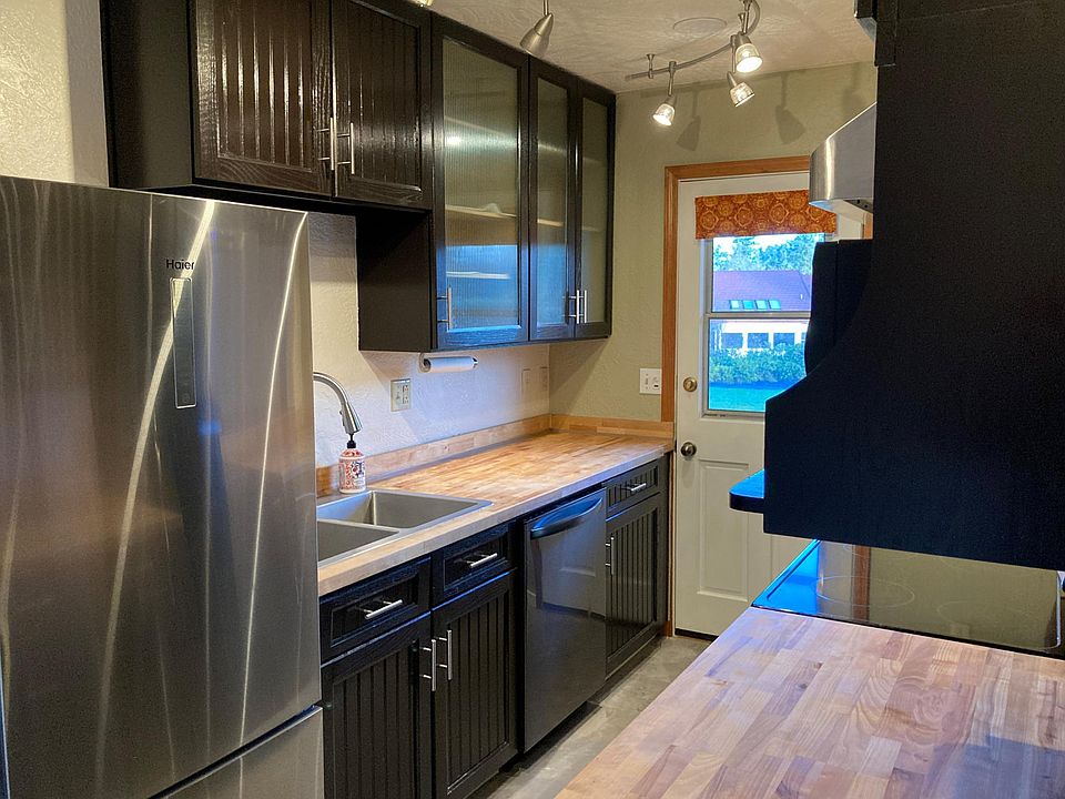 Kitchen with lighted beaded glass cabinets and