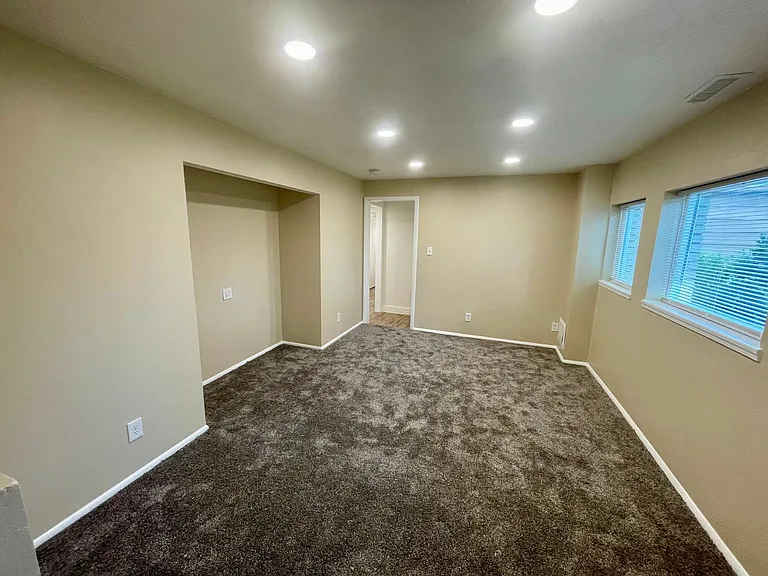Family room or bedroom. Nice south facing windows.