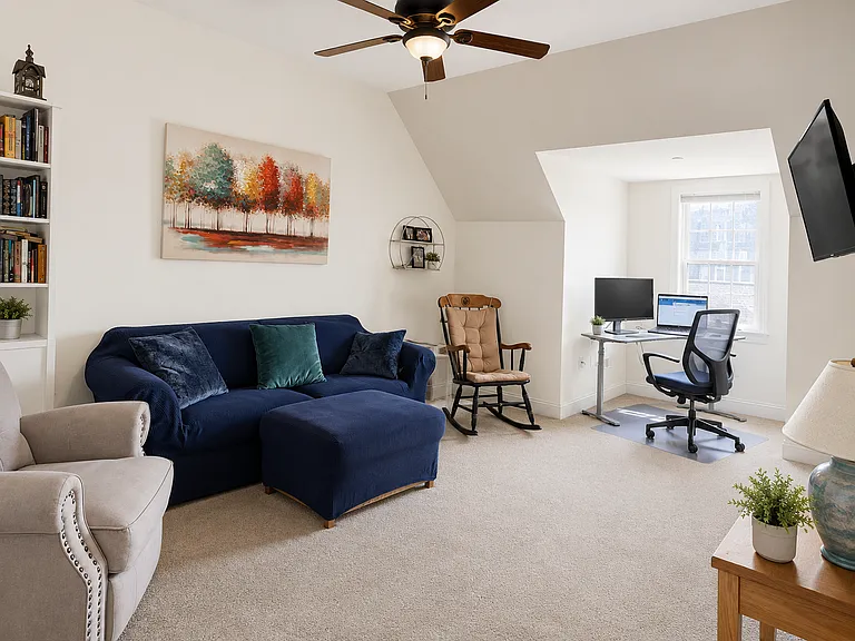 Primary suite / master bedroom on third floor. Currently used as extra living room and has its own walk in closet and master bathroom.