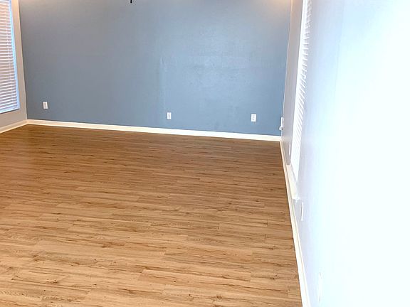 Living room area facing accent wall, lower level