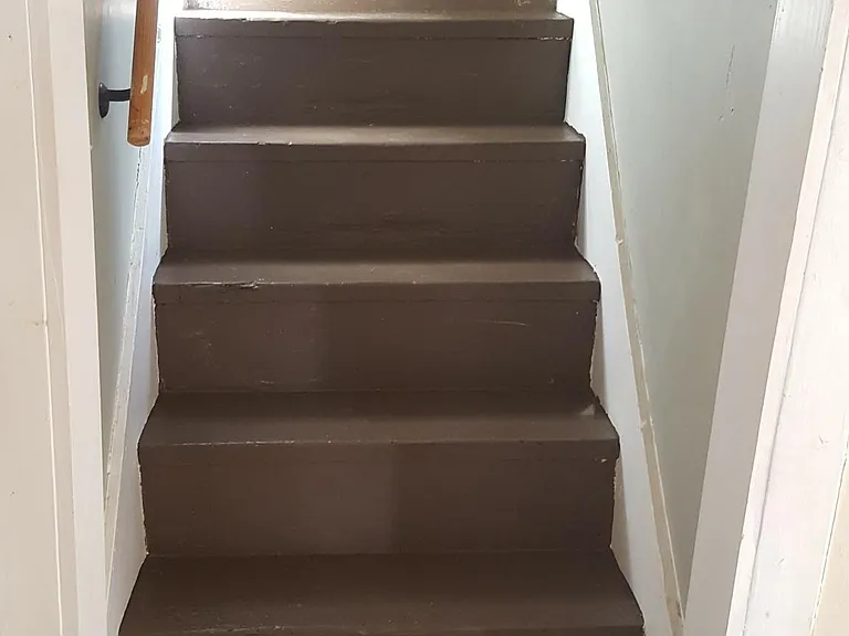 Steps to upstairs den/music room or 3rd bedroom .