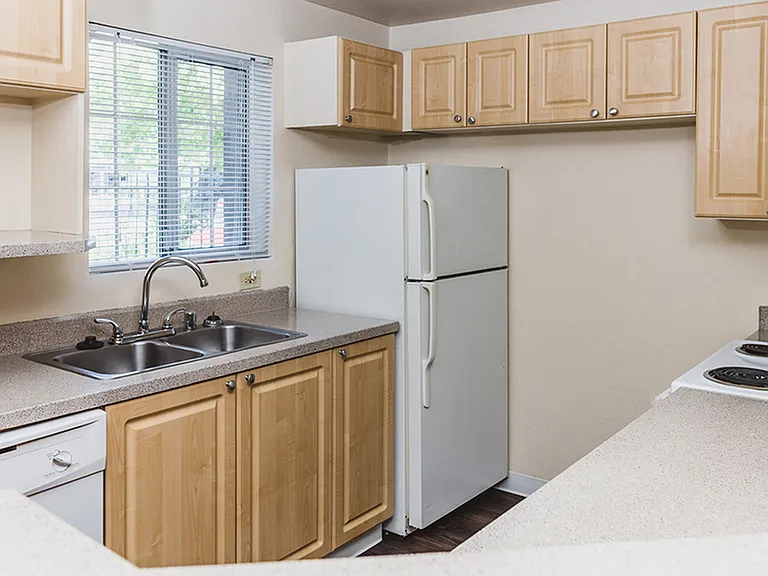 Classic style kitchen featuring window over kitchen sink