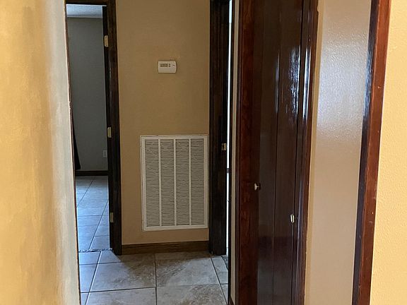 Hallway leading to 3 bedrooms