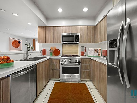 Large-Size Kitchen with Stainless-Steel Appliances and Ample Cabinet Storage