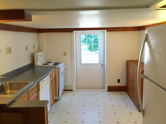 Kitchen has a dishwasher and new fridge and stove.