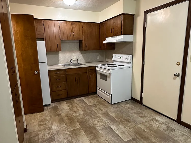 Traditional townhome. Laminate flooring and wood cabinets.