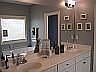 Master Bathroom with double vanity, more great lighting, and jetted tub.