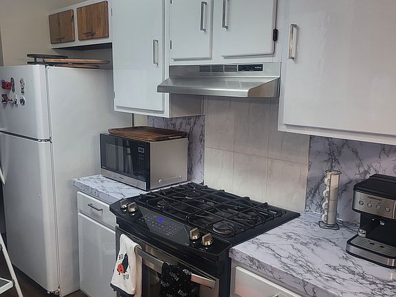 Kitchen with wood cabinets