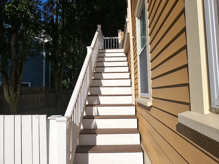 Entry on side of house. Leads up to back deck.