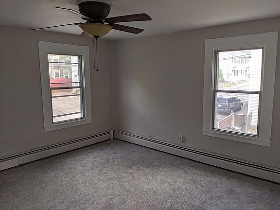 Large living room with large windows with lots of natural lighting