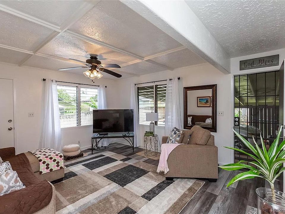 Living area. Door on right goes to car port. There is a door on left that goes to a side entrance, but we never use that door.