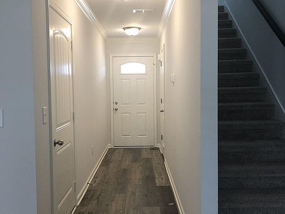 Private entrance from covered front porch and 2 car garage