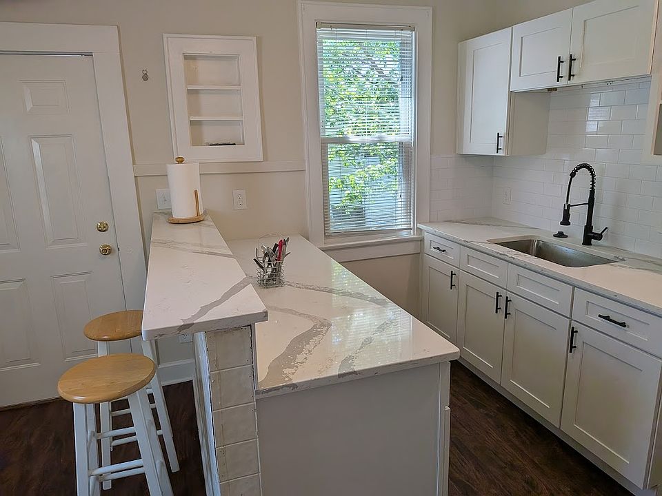 NEW kitchen cabinets, dishwasher, microwave, gas stove, disposal, and refrigerator all included.