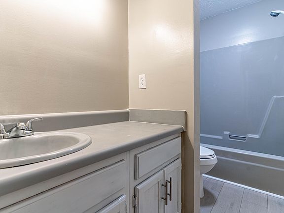 Downstairs bathroom with bathtub.