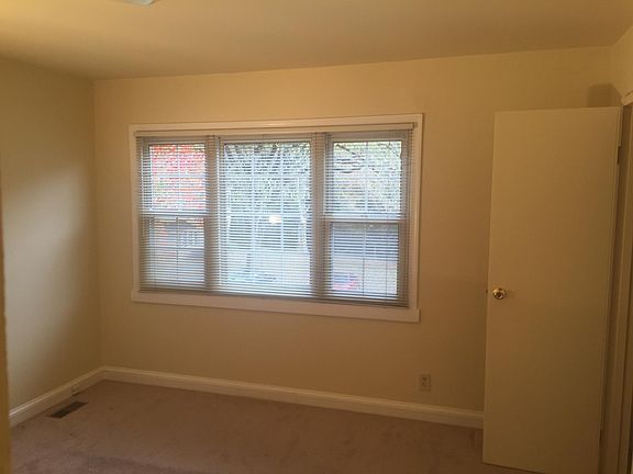 large windows allow plenty of light into the front bedroom