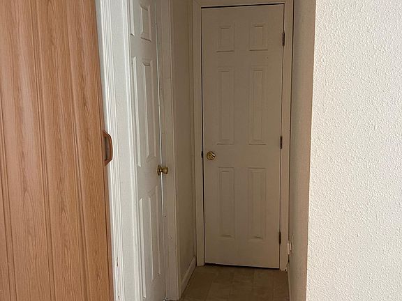Hallway to bathroom, closet, and laundry