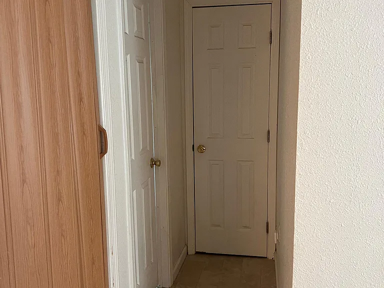 Hallway to bathroom, closet, and laundry