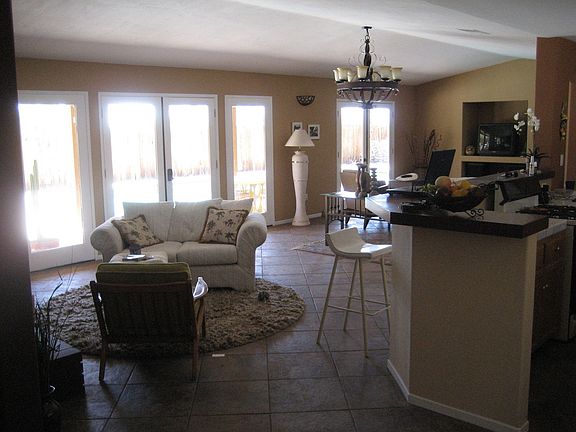 View from front door toward kitchen, living room and out to yard.