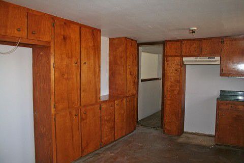 Lots of cabinet space. Stained concrete flooring.