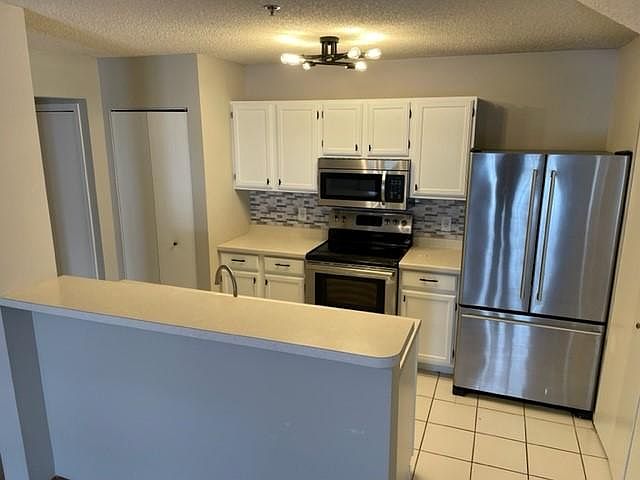 Bright kitchen with breakfast bar...