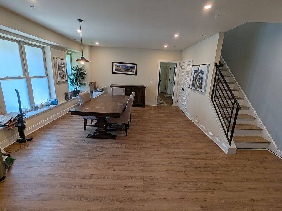 Dining Room, Staircase, & View Into First Floor Master Suite