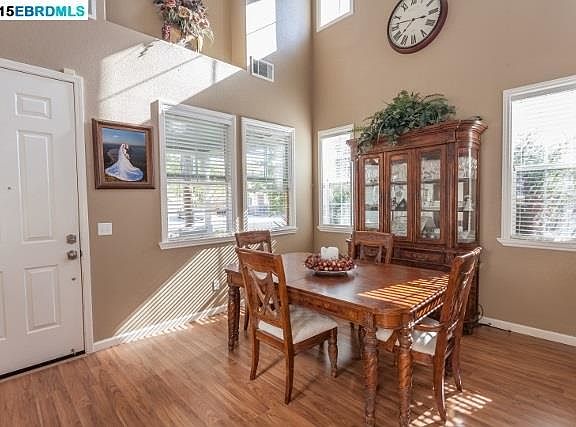 Versatile formal living area can be used as a formal living or dining area.