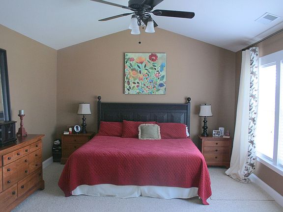 master bedroom with vaulted ceilings