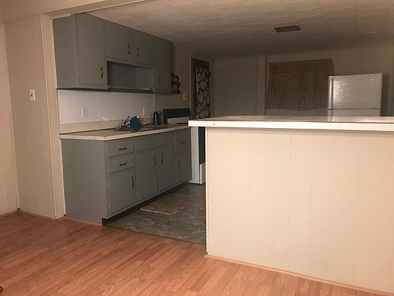 Entrance to kitchen with bar