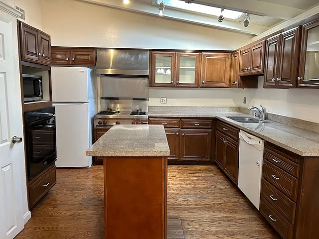 Modern Kitchen with Premium Wolf Gas Cooktop & Grill and marble counter top