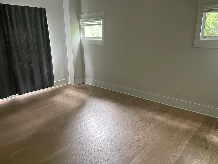 Primary bedroom. Beautiful hardwood floors.