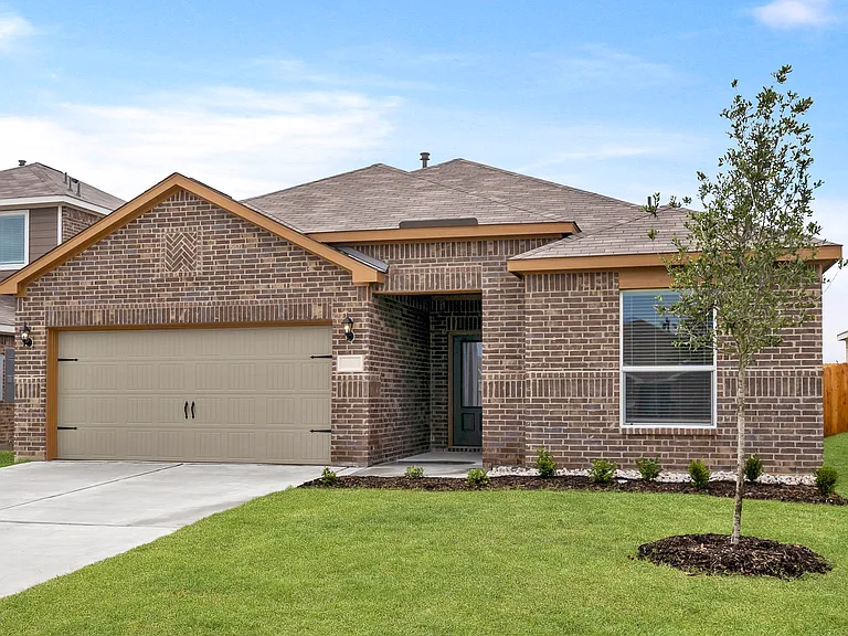 The Reed is a beautiful one-story brick home.