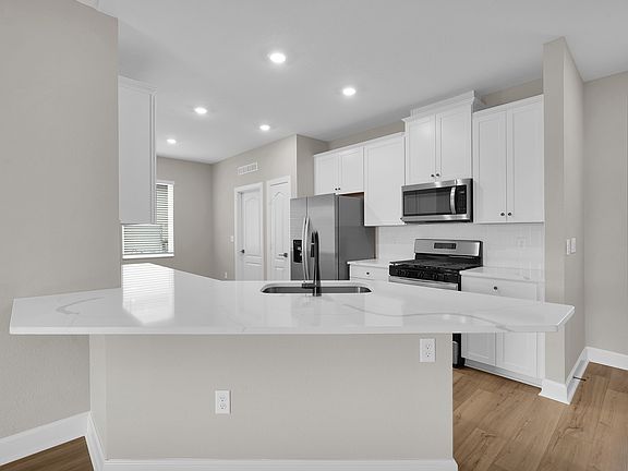 A chef-ready kitchen with spacious countertops and a island perfect for preparation or casual dining