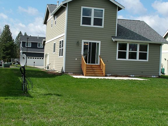 back of home and some of back yard