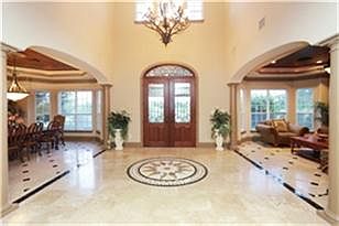 This palatial entrance displays the custom made floor medallion with exquisite marble inlays and imp
