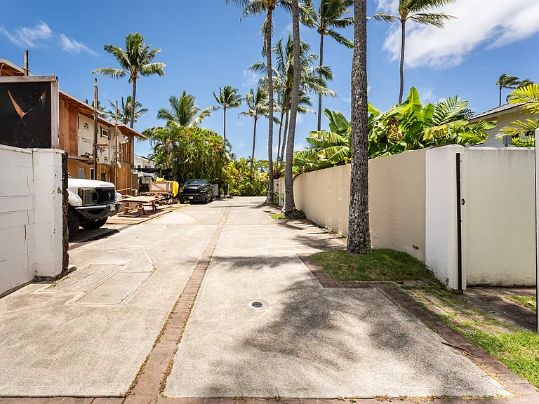 Private beach access pathway located just outside the backyard gate, providing convenient access to Kailua Beach.
