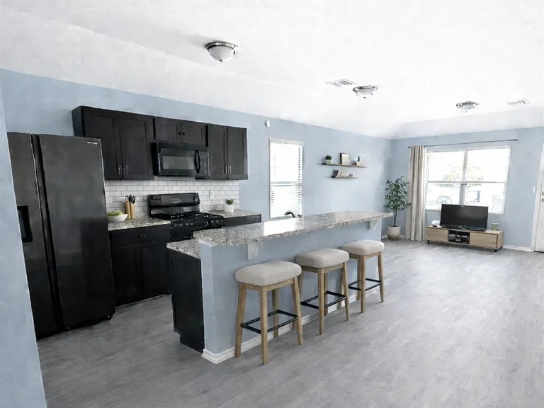 kitchen and living area, vinyl flooring throughout the home- no carpeted areas.