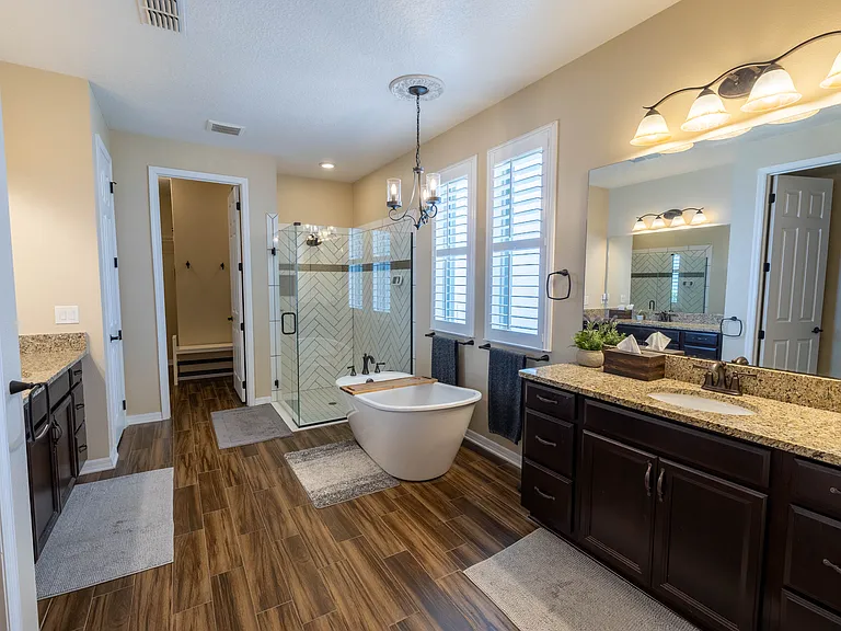 Primary Bathroom with 2 Walk-In Closets, His and Hers Sinks, and Linen Closet